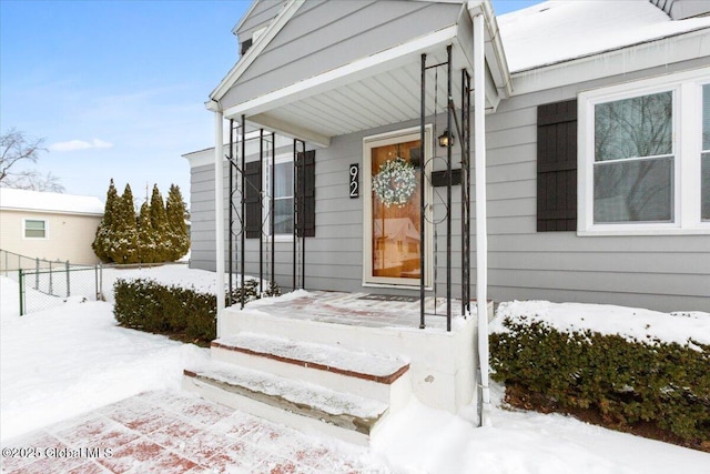 view of snow covered property entrance