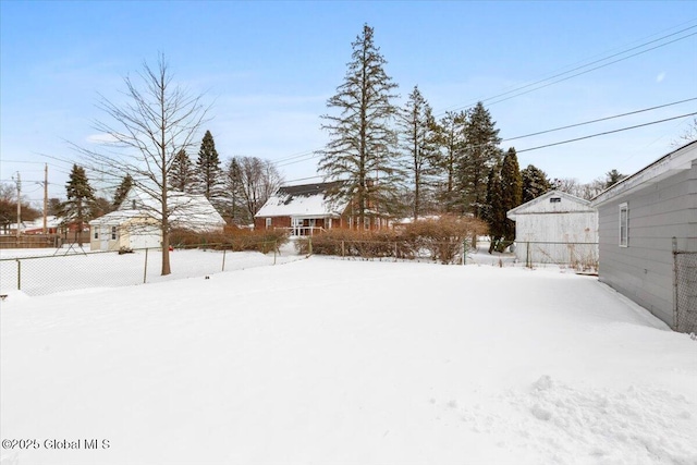 view of yard layered in snow