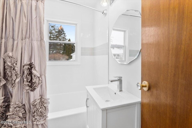 bathroom with vanity and shower / tub combo