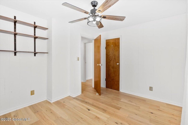 unfurnished room featuring ceiling fan and light wood-type flooring