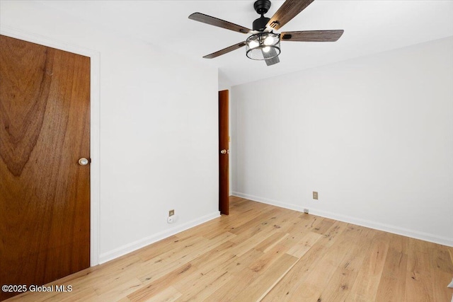 spare room featuring light hardwood / wood-style flooring and ceiling fan