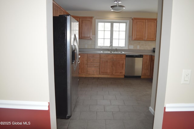 kitchen featuring sink, backsplash, and stainless steel appliances