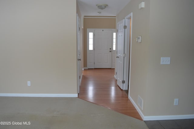 corridor featuring hardwood / wood-style floors