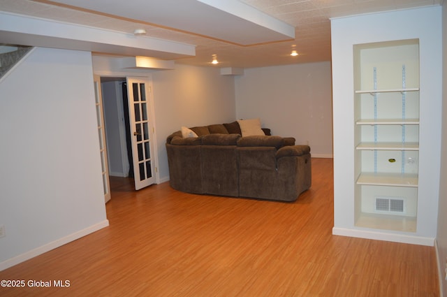 living room with light hardwood / wood-style flooring