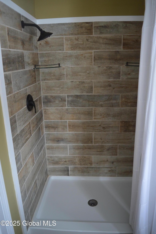 bathroom featuring walk in shower