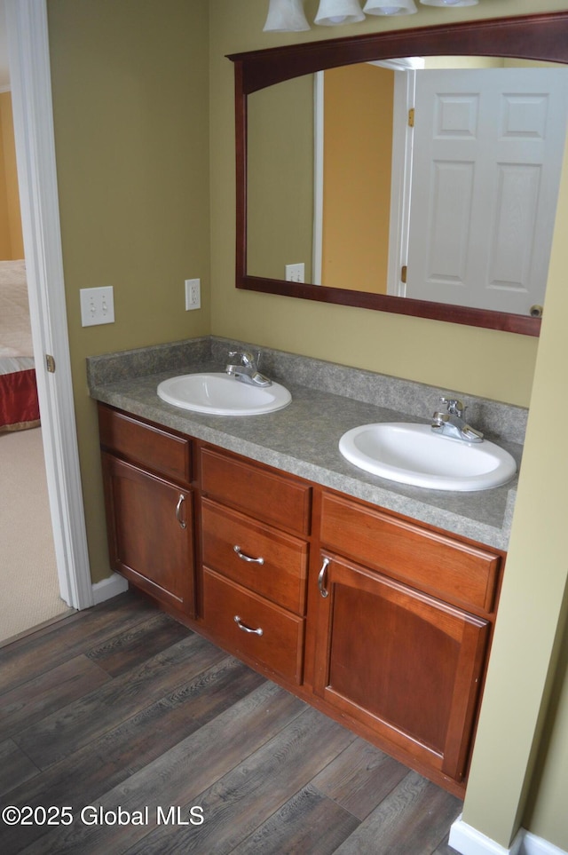 bathroom with wood-type flooring and vanity