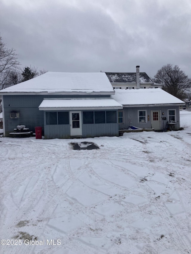 view of snow covered house