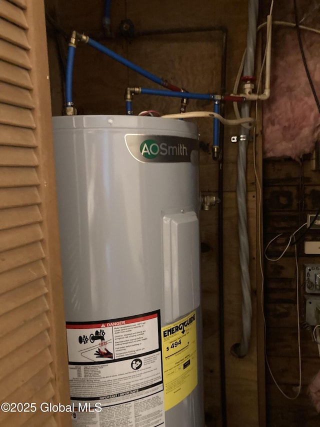 utility room featuring water heater