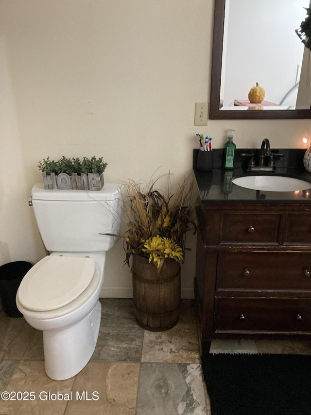 half bath with toilet and vanity