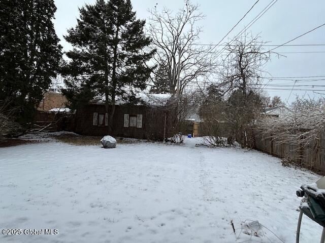 view of yard covered in snow