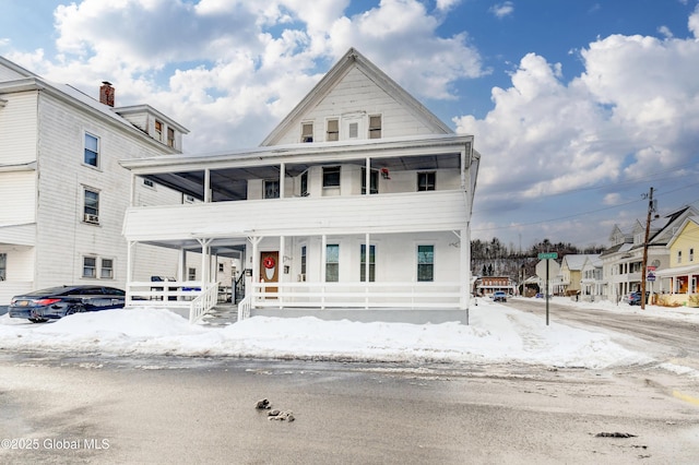 view of front of house with a balcony