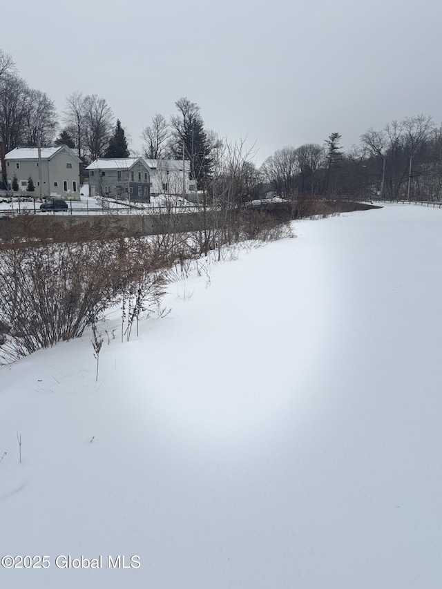 view of yard layered in snow