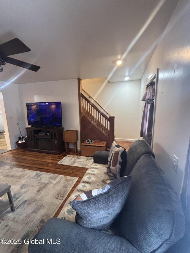86 Reid St, Fort Plain, NY 13339 - living room featuring stairway, wood finished floors, and ceiling fan