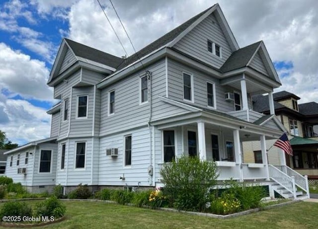 exterior space featuring a lawn and covered porch