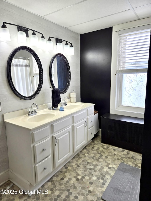 bathroom with vanity and a paneled ceiling