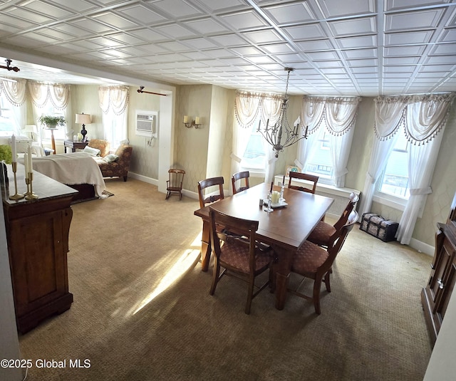 carpeted dining room featuring a wall mounted AC and an inviting chandelier