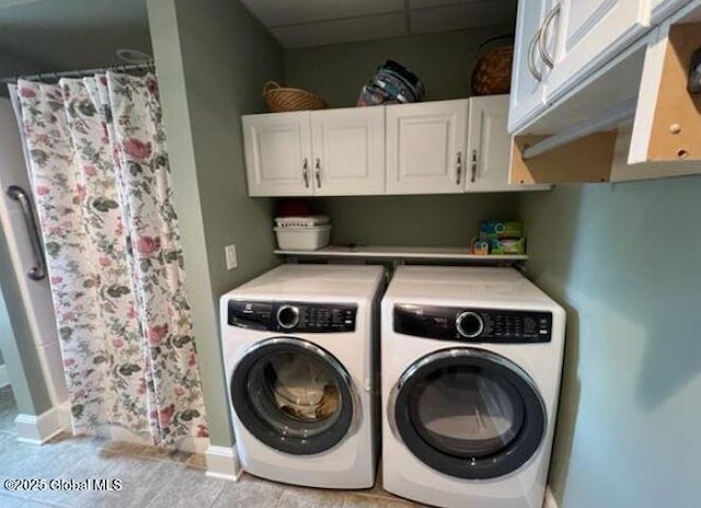 washroom with cabinets and independent washer and dryer