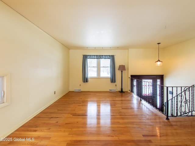 unfurnished living room featuring light hardwood / wood-style flooring