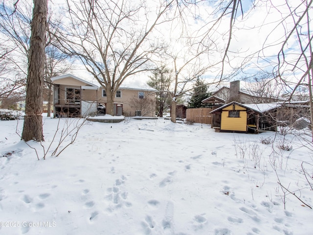 view of yard layered in snow