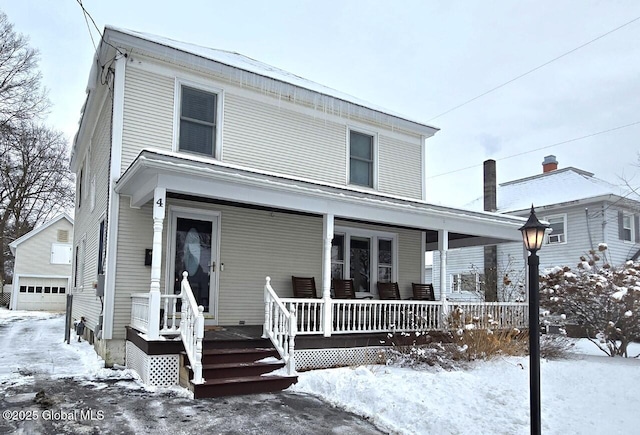 view of front of house featuring a garage and covered porch