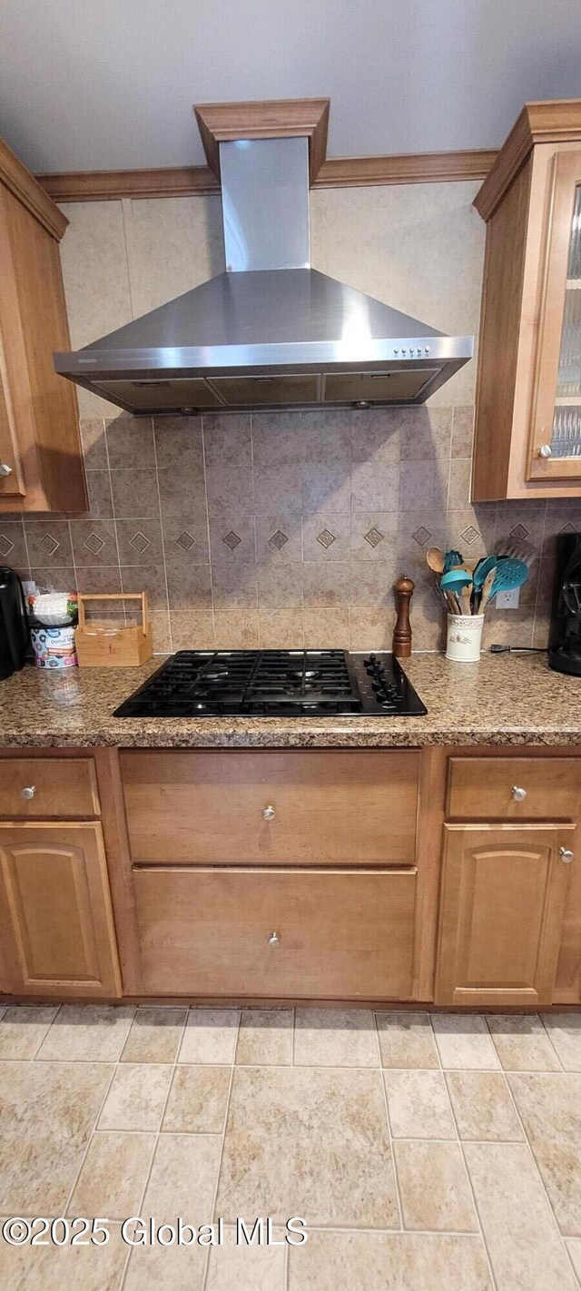 kitchen featuring extractor fan, decorative backsplash, black gas stovetop, and light tile patterned flooring