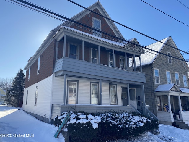 view of front of house with a porch and a balcony