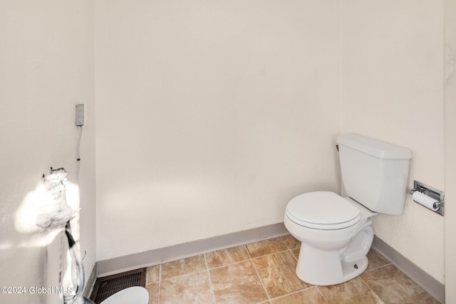 bathroom with tile patterned floors and toilet