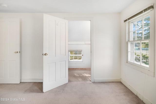 unfurnished bedroom with light carpet