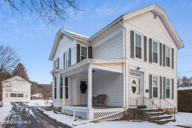 view of front of house with a garage and covered porch