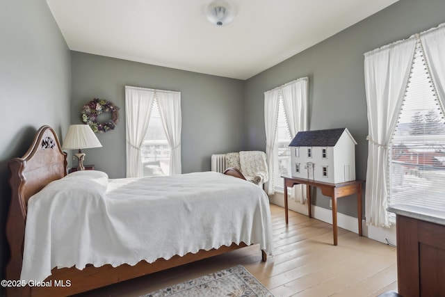 bedroom with light hardwood / wood-style flooring