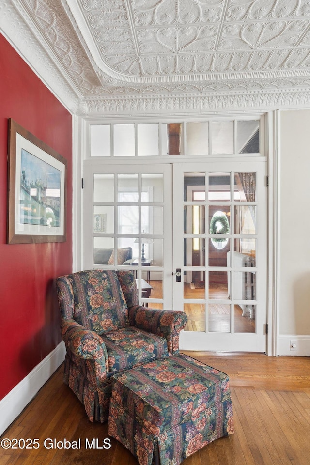 living room featuring wood-type flooring and french doors