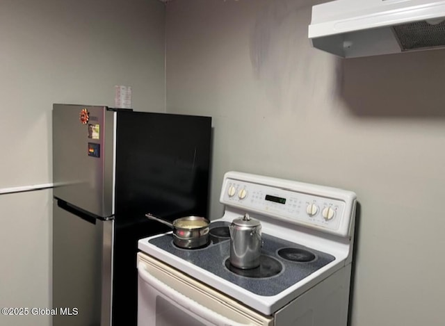 kitchen with stainless steel fridge and white range with electric cooktop