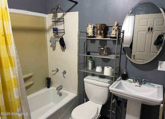 full bathroom featuring toilet, sink, and shower / bath combo with shower curtain