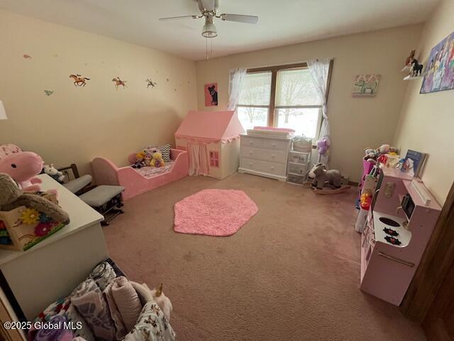 carpeted bedroom with ceiling fan