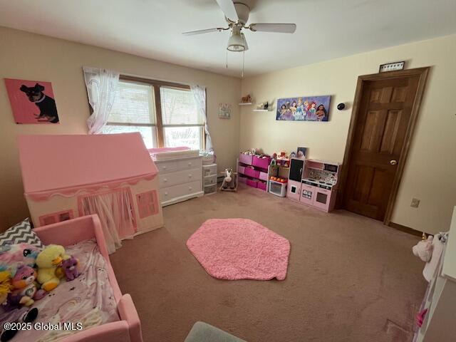 bedroom with light colored carpet and ceiling fan