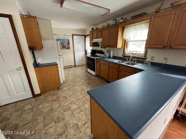 kitchen featuring sink and white appliances