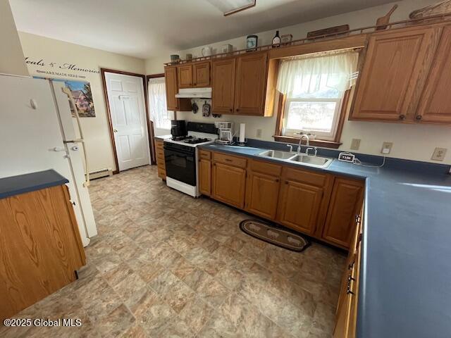 kitchen with sink and white appliances