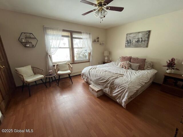 bedroom featuring ceiling fan and hardwood / wood-style floors