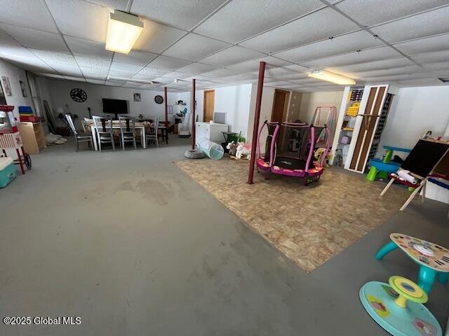 basement featuring a paneled ceiling