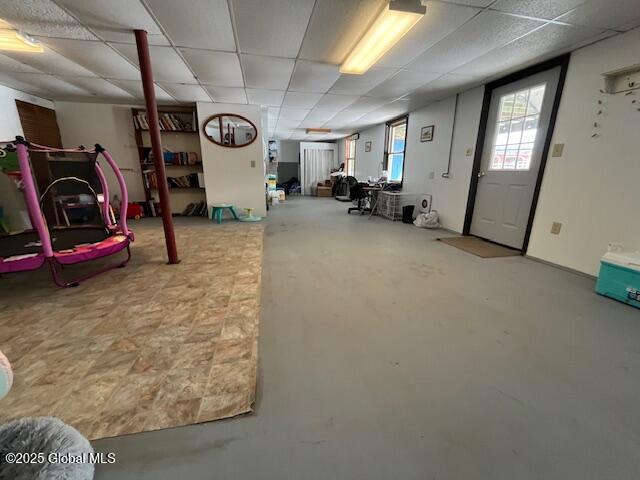 basement featuring a paneled ceiling