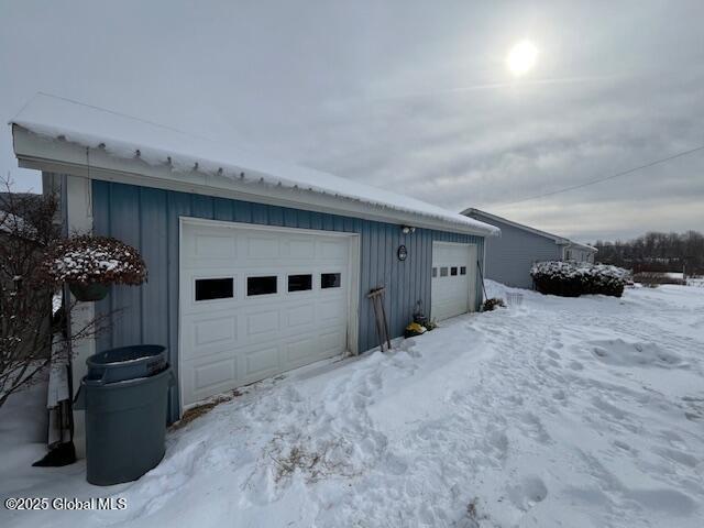 view of snow covered garage