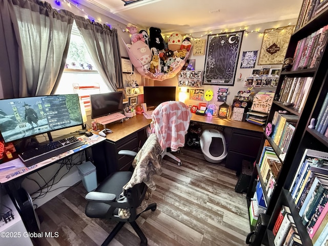 office space featuring hardwood / wood-style flooring and built in desk