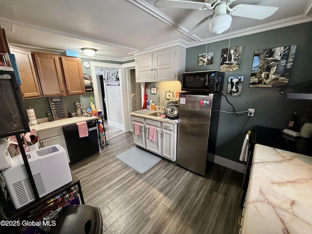 kitchen with sink, light hardwood / wood-style flooring, ceiling fan, ornamental molding, and black appliances