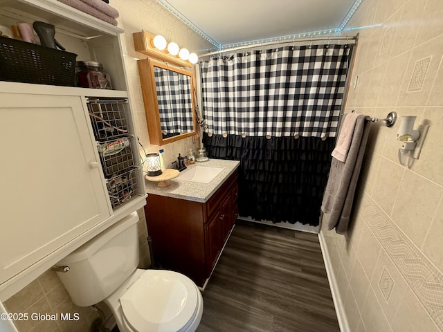 bathroom featuring vanity, tile walls, curtained shower, and toilet