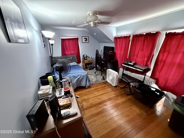 bedroom featuring wood-type flooring and ceiling fan