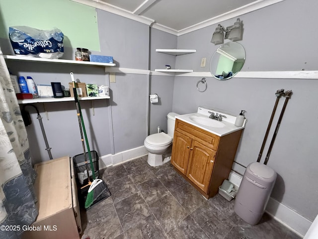 bathroom featuring vanity, ornamental molding, and toilet