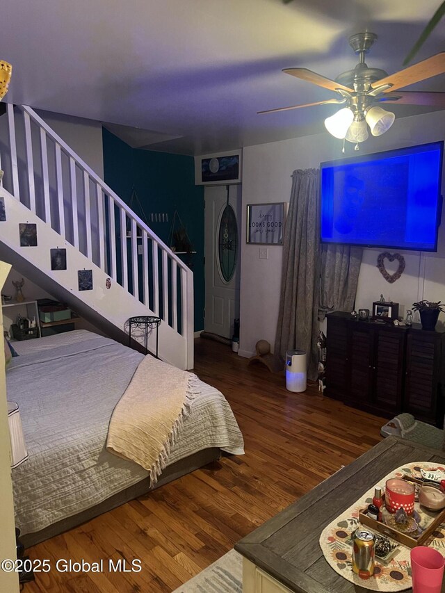 bedroom featuring hardwood / wood-style floors and ceiling fan