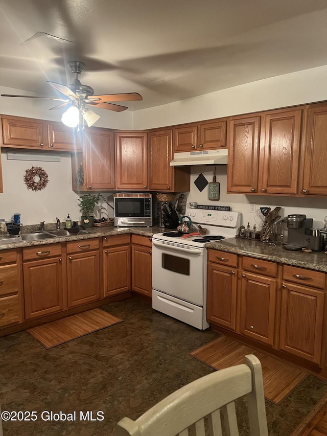 kitchen featuring white electric stove, sink, and ceiling fan