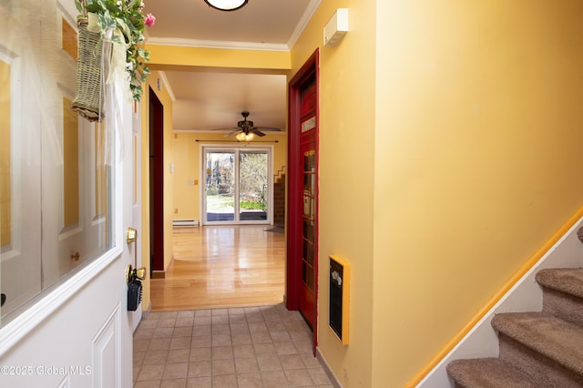 hall with stairway, light tile patterned floors, ornamental molding, and a baseboard heating unit