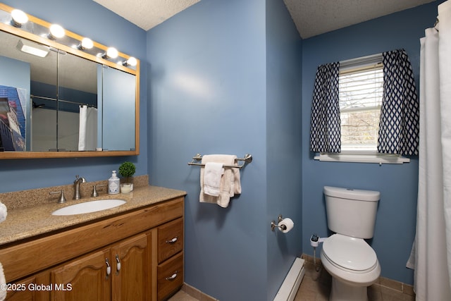bathroom featuring toilet, a baseboard heating unit, a textured ceiling, and vanity